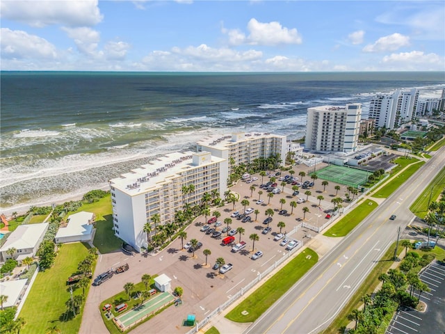 bird's eye view featuring a beach view and a water view