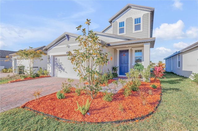 view of front of home with a garage and a front yard