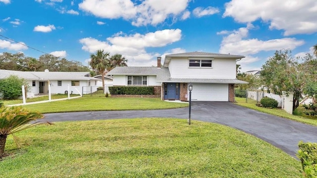 view of front facade with a front yard and a garage