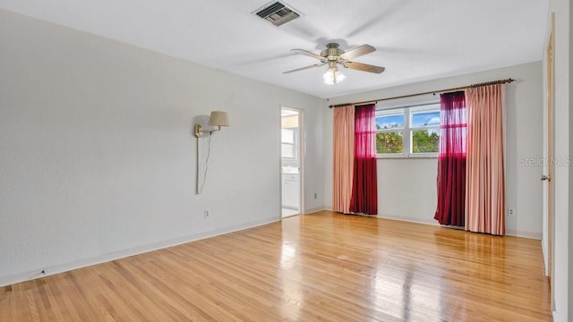 empty room featuring ceiling fan and wood-type flooring