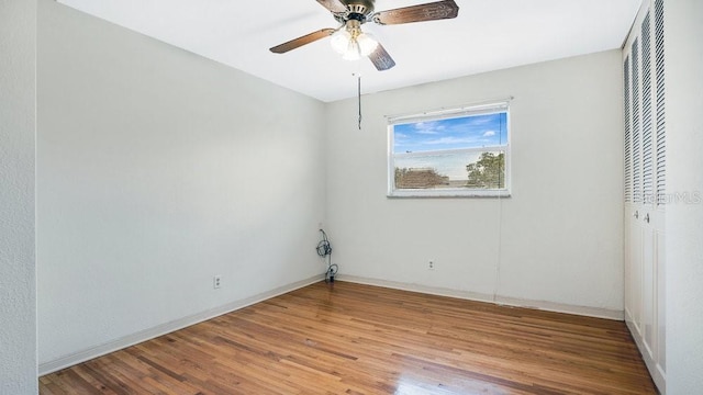 unfurnished room with light wood-type flooring and ceiling fan