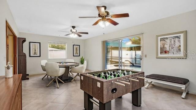 game room featuring ceiling fan and light tile patterned floors