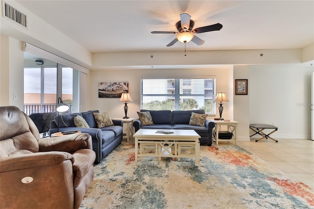 tiled living room featuring ceiling fan