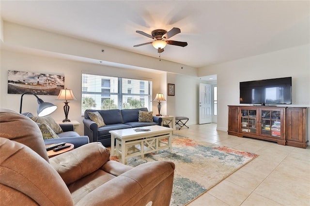 tiled living room featuring ceiling fan