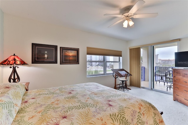 bedroom featuring access to exterior, light carpet, multiple windows, and ceiling fan