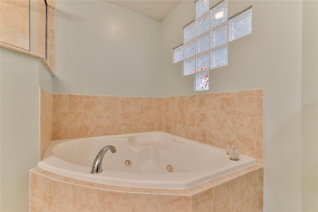 bathroom featuring tiled tub