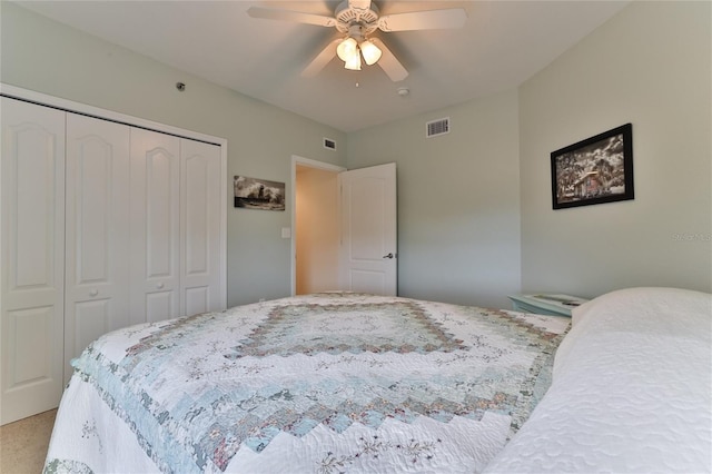 bedroom with carpet, a closet, and ceiling fan