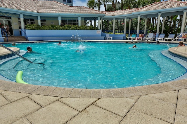 view of pool featuring pool water feature