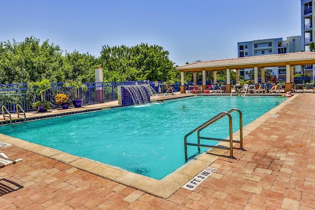 view of pool with pool water feature and a patio area