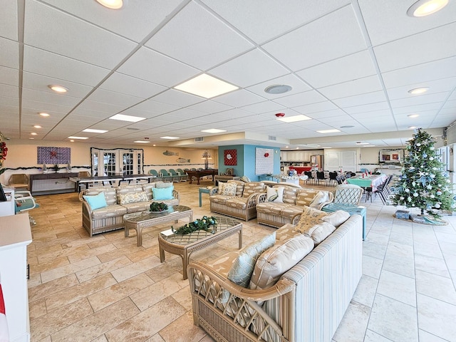 3606 S Peninsula Dr Unit 404, Port Orange, FL 32127 - living area with stone tile flooring, a paneled ceiling, and recessed lighting