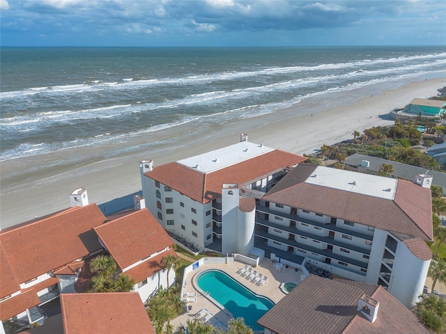 bird's eye view featuring a beach view and a water view