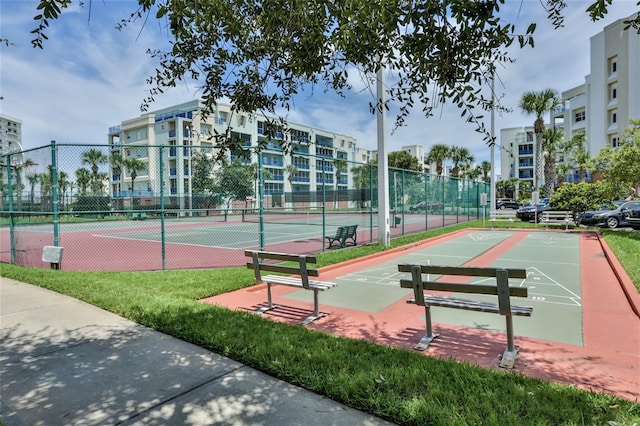 view of tennis court featuring basketball court