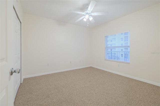 empty room featuring carpet and ceiling fan