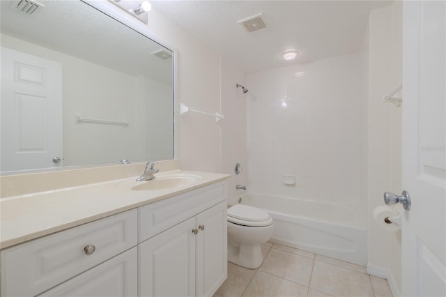 full bathroom with tile patterned floors, a textured ceiling, vanity, washtub / shower combination, and toilet