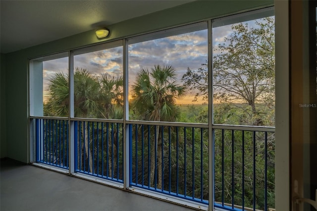 unfurnished sunroom featuring plenty of natural light