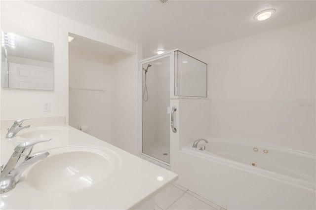 bathroom with tile patterned flooring, vanity, separate shower and tub, and a textured ceiling