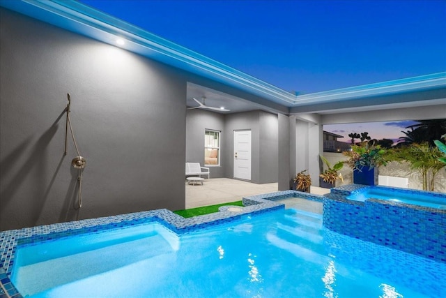 view of swimming pool with an in ground hot tub and a patio