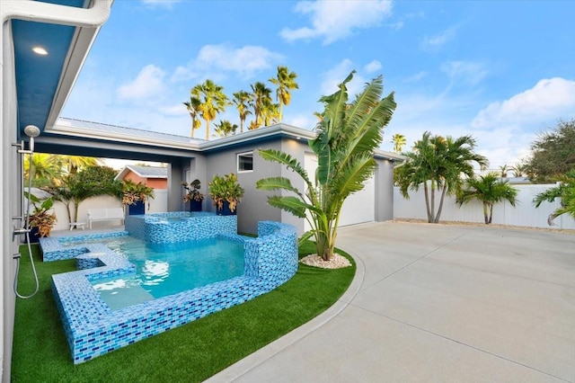 view of front of house featuring a patio and a pool with hot tub