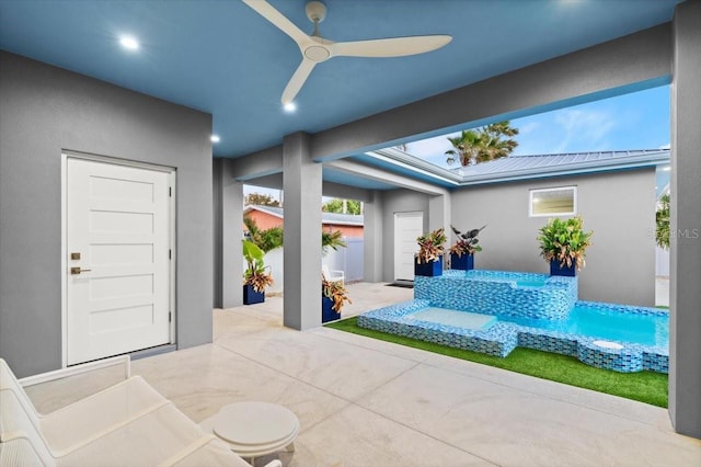 view of patio featuring ceiling fan