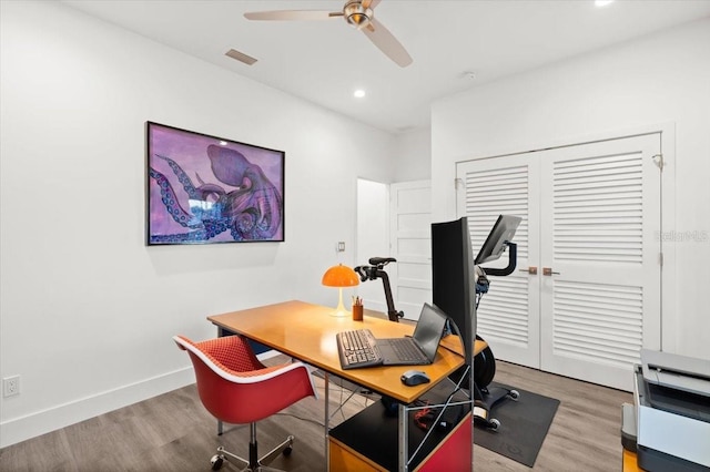 office area with ceiling fan and hardwood / wood-style floors