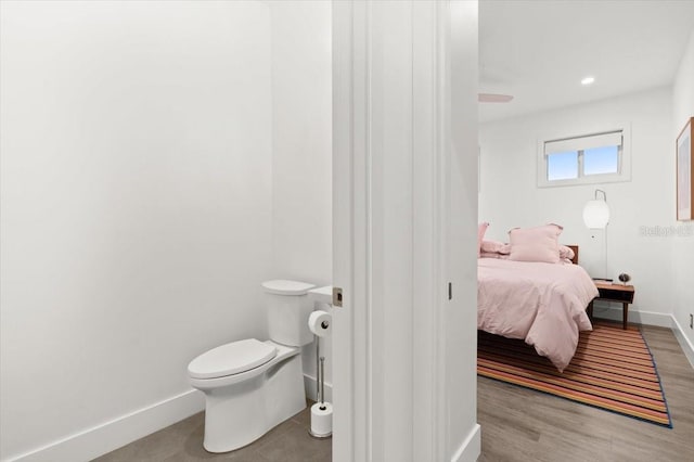 bathroom featuring toilet and hardwood / wood-style flooring