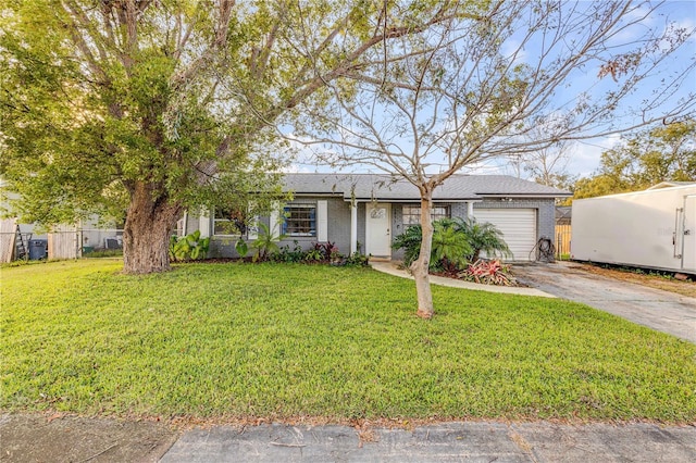 view of front of home featuring a garage and a front yard