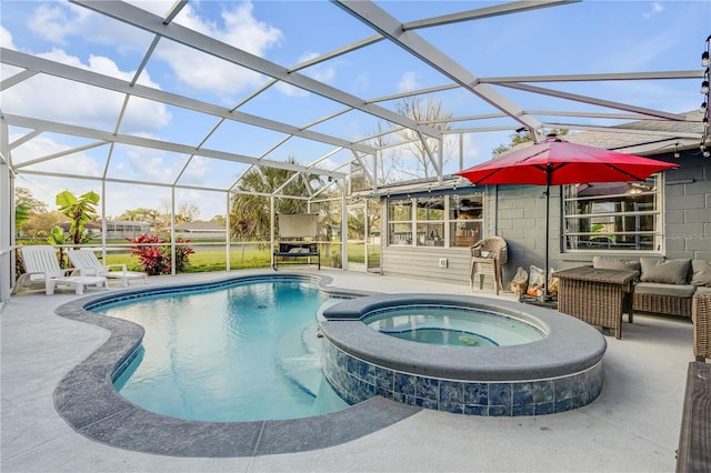 view of swimming pool with a lanai, a patio area, and an in ground hot tub