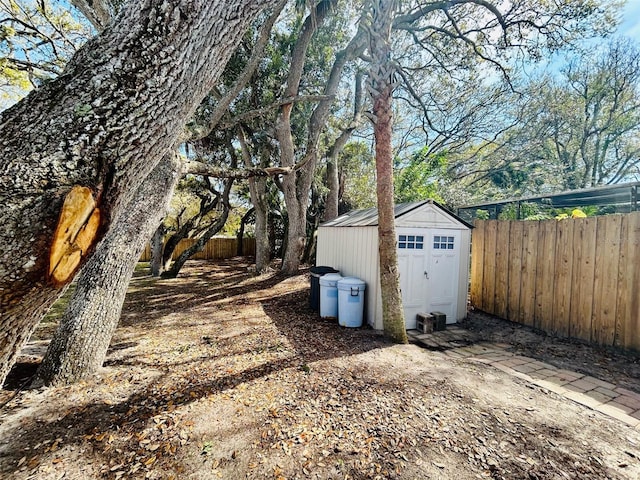 exterior space with a shed