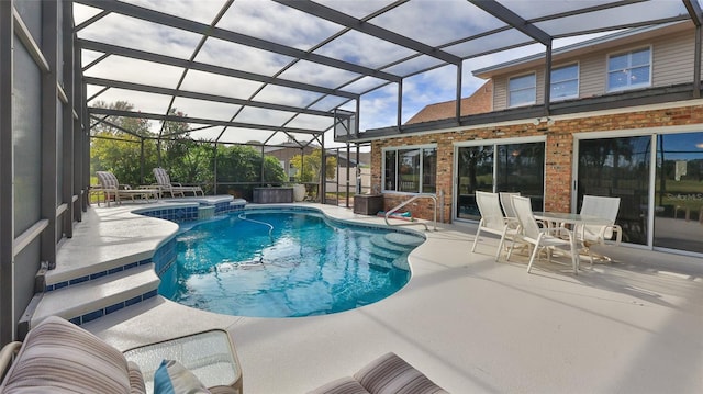 view of pool featuring a lanai and a patio