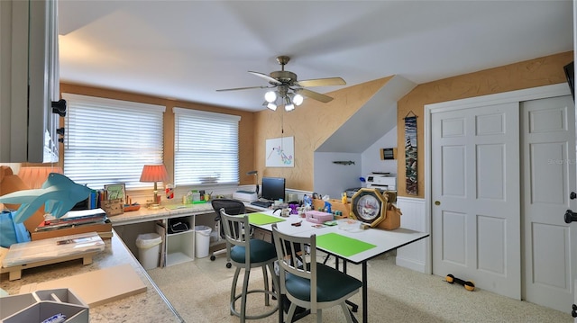 carpeted office featuring ceiling fan