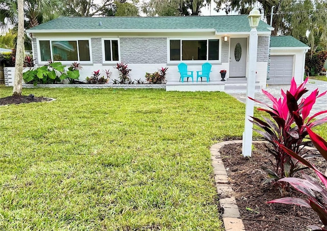 exterior space featuring a lawn and a garage