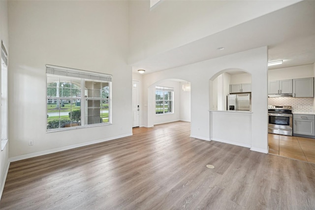 unfurnished living room with light hardwood / wood-style flooring