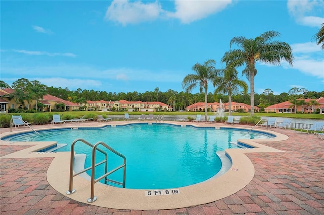 view of pool featuring a patio area