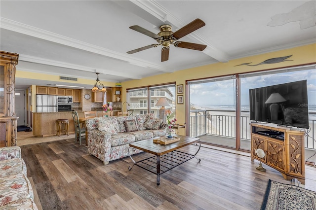 living room featuring beamed ceiling, ceiling fan, ornamental molding, and dark hardwood / wood-style floors