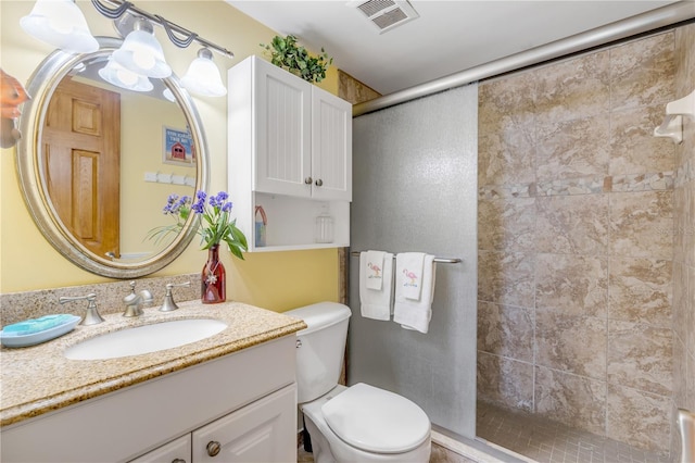 bathroom featuring walk in shower, vanity, toilet, and a notable chandelier