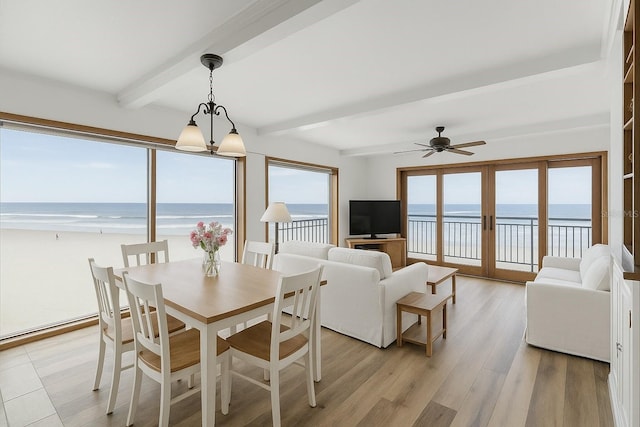 4811 Saxon Dr Unit C102, New Smyrna Beach, FL 32169 - dining area with a water view, plenty of natural light, beamed ceiling, and ceiling fan