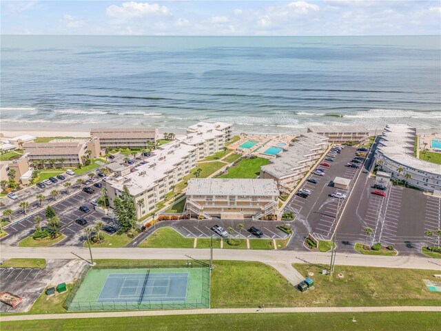 4811 Saxon Dr Unit C102, New Smyrna Beach, FL 32169 - drone / aerial view featuring a water view and a beach view