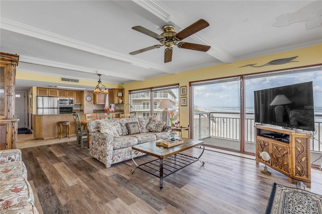 4811 Saxon Dr Unit C102, New Smyrna Beach, FL 32169 - living area with visible vents, a ceiling fan, wood finished floors, and beamed ceiling