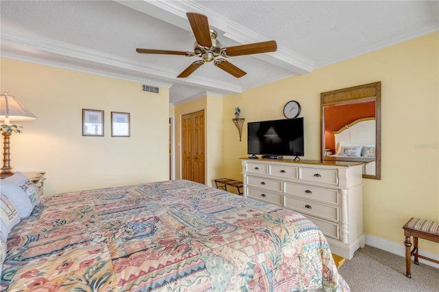 4811 Saxon Dr Unit C102, New Smyrna Beach, FL 32169 - bedroom featuring ceiling fan, visible vents, a closet, ornamental molding, and light carpet