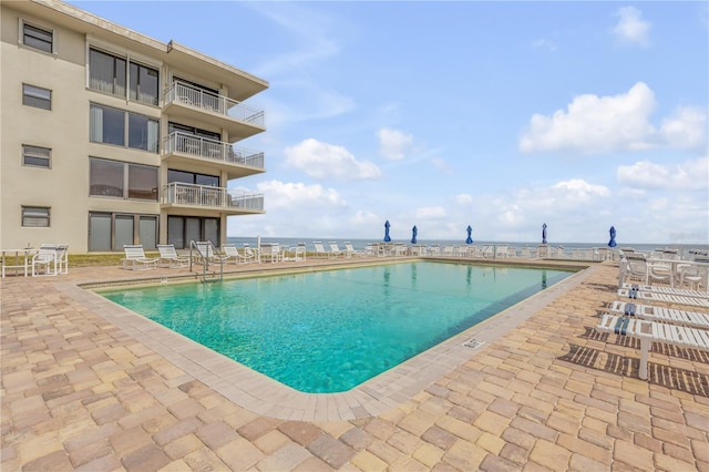 4811 Saxon Dr Unit C102, New Smyrna Beach, FL 32169 - pool featuring a patio