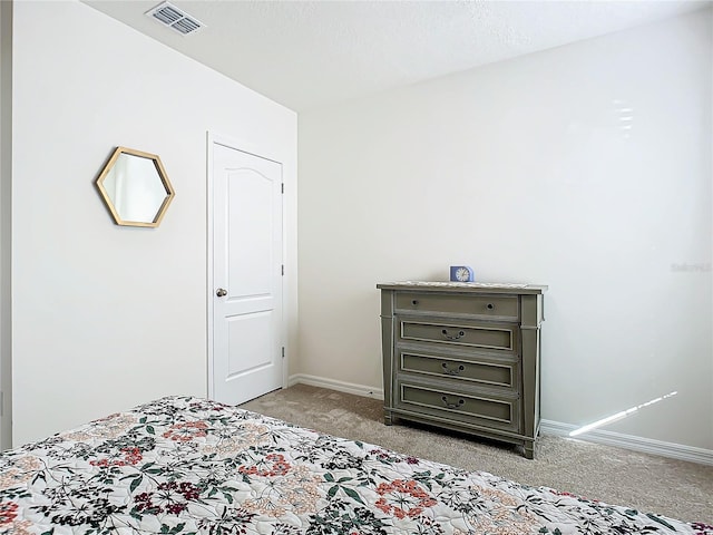 unfurnished bedroom featuring light carpet