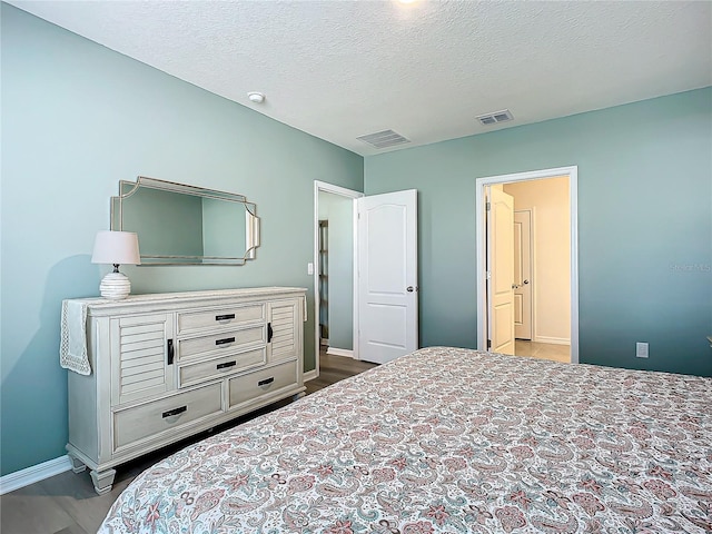 bedroom with a textured ceiling