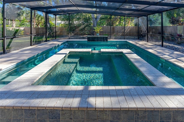 view of swimming pool with glass enclosure and an in ground hot tub