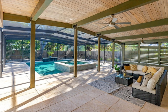 view of swimming pool with an in ground hot tub, outdoor lounge area, a patio, and glass enclosure