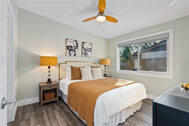 bedroom featuring ceiling fan and dark hardwood / wood-style flooring