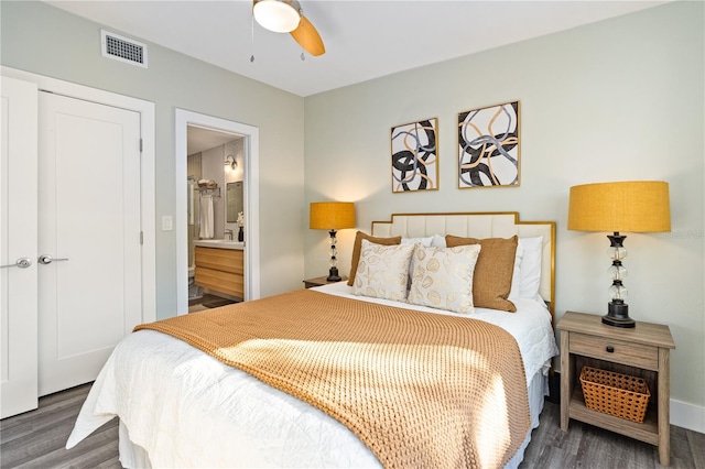 bedroom featuring ensuite bathroom, ceiling fan, and dark hardwood / wood-style floors