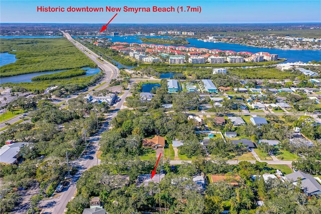 birds eye view of property with a water view