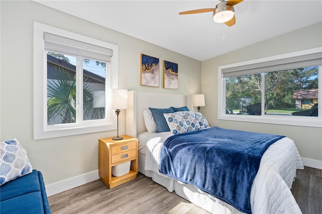 bedroom with wood-type flooring and ceiling fan