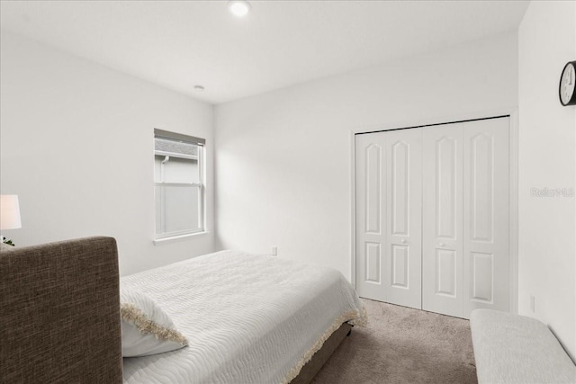 carpeted bedroom featuring a closet