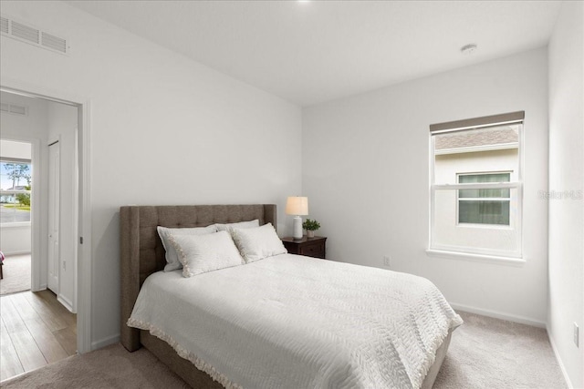 bedroom with hardwood / wood-style flooring